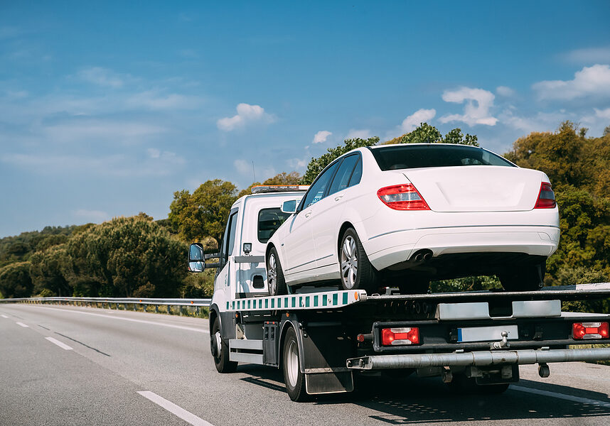 Car Service Transportation Concept. Tow Truck Transporting Car Or Help On Road Transports Wrecker Broken Car. Auto Towing, Tow Truck For Transportation Faults And Emergency Cars . Tow Truck Moving In Motorway Freeway Highway.